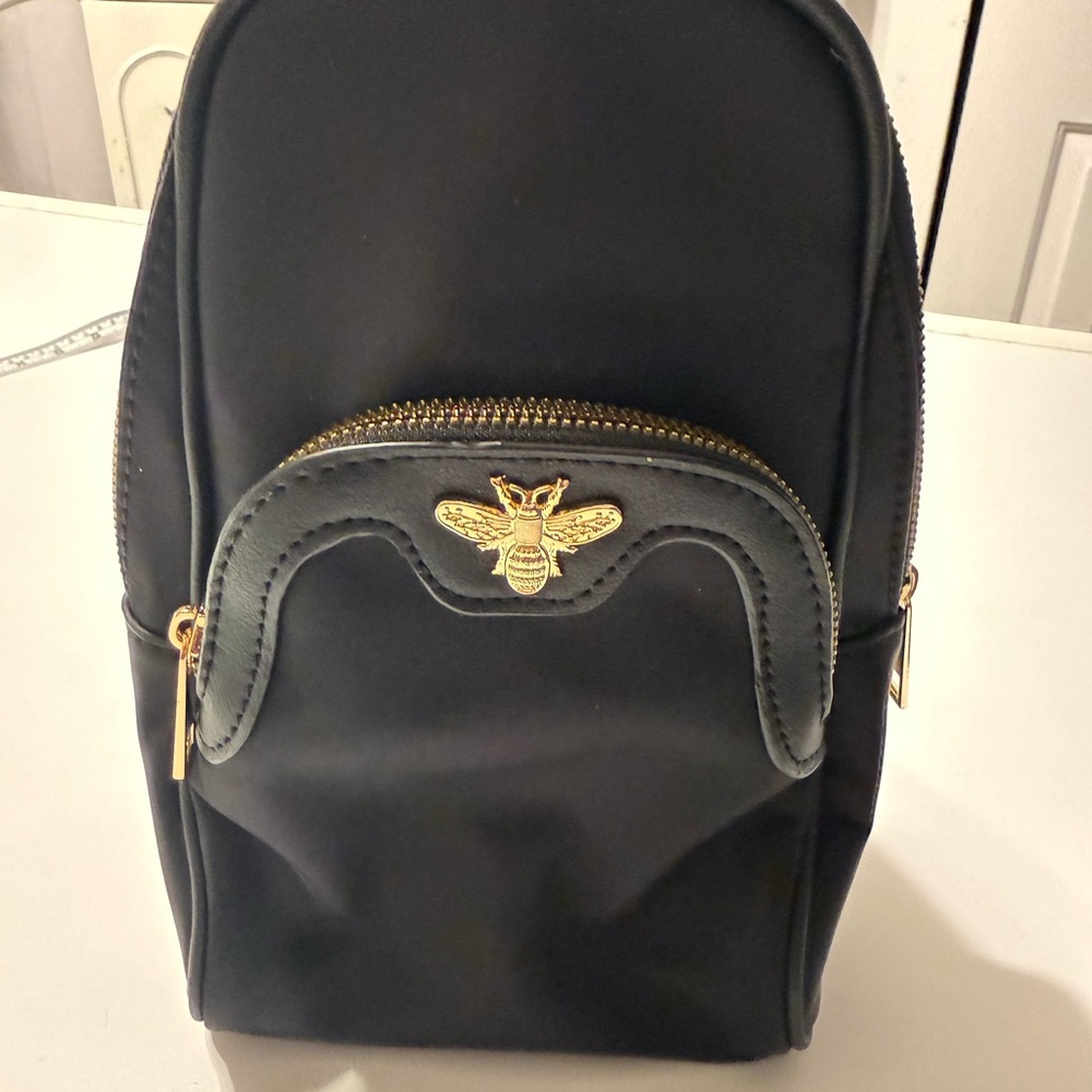 Elegant Black Crossbody Bag with Gold Accents